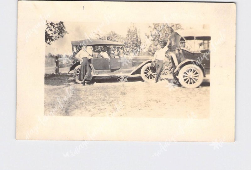 RPPC REAL PHOTO POSTCARD ANTIQUE CARS FORD MODEL A? PEOPLE POSING NEXT TO CARS A