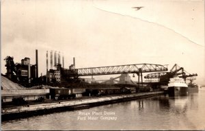 Real Photo Postcard Rouge Plant Docks Ford Motor Company in Dearborn, Michigan