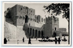 1937 Sheep Passing Building View Greetings from Aleppo Syria RPPC Photo Postcard