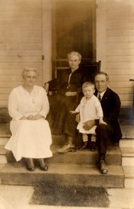 RPPC - A Photo of the Family sitting on the Porch - c1910