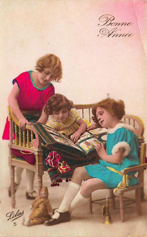 Hand Tinted French Children Browsing Postcard Album RPPC