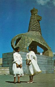Ethiopia two of Addis Ababa fairest in national dress in front of Lion of Judah
