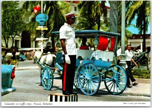 VINTAGE CONTINENTAL SIZE POSTCARD CONSTABLE ON TRAFFIC DUTY AT NASSAU BAHAMAS