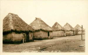 RPPC Postcard; Street Scene Pacora Panama Row of Thatched Huts w/ Grass Roofs