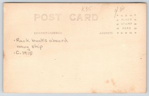 WWI Navy Ship Interior~Sailor Rack Bunks Folded Up~Stuff Inside~c1918 RPPC 