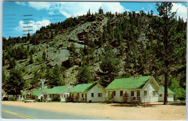 c1970s Estes Park, CO Whispering Pine Motel & Cabins Chrome Postcard River A52