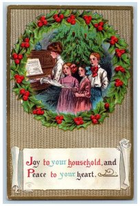 Christmas Postcard Woman Playing Piano Caroling Holly Berries Whreath Embossed