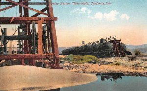 OIL CARS AT SHIPPING STATION BAKERSFIELD CALIFORNIA TRAIN POSTCARD (c. 1910)