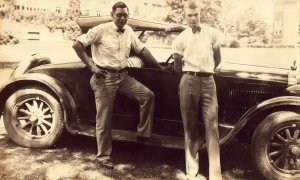 2 Men standing by old car Real Photo Postcard