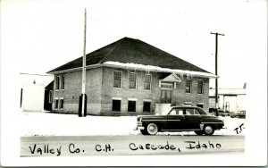 Vtg Postcard RPPC Cascade Idaho ID - Valley County Court House Street View Car 