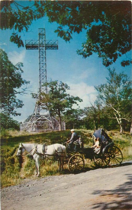 Canada Cross on top Mount Royal and horse drawn caleche