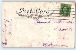 c1910's Easter Little Boy Writing Bunny Rabbit Pipe Berry Embossed Postcard