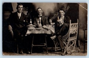 Mens Postcard RPPC Photo Sat On Wicker Chair Drinking Alcohol c1910's Antique