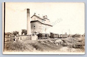 K12/ Riverside Iowa RPPC Postcard c1910 Railorad Mill Fatory Tower 461