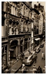 Hotel Suisse on Kalverstraat Amsterdam RPPC Postcard with Old Cars Street Scene