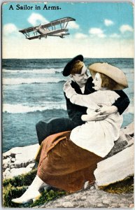 Young Man and Woman Along Shoreline A Sailor in Arms. - Vintage Postcard