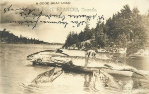 Fishing Exaggeration RPPC; Good Boat Load Huge Fish Fort Frances Ontario Canada