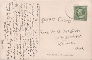 Geneva, Nebraska-Man loading giant Giant Pumpkins into wagon-1916