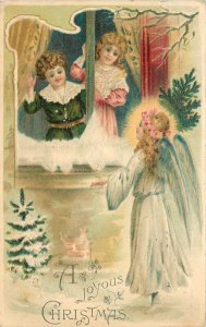 Embossed Christmas Postcard Children Look at Shining Angel in Snow  B.W. 272
