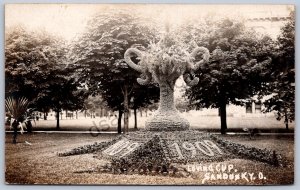 K47/ Sandusky Ohio RPPC Postcard c1910 Loving Cup Floral Display Park 135
