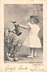 H79/ Interesting Postcard Watering Can Garden c1910 Comic Girl 146