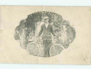 rppc 1920's MAN HAS HEADLIGHT ON HIS ANTIQUE BICYCLE AC8737