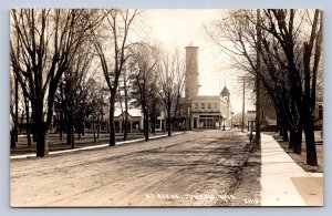 J90/ Juneau Wisconsin RPPC Postcard c1910 Stores Park Street Scene 320