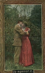 Vintage Postcard 1911 Up Against It.  Couple in Warm Embrace Kissing Love