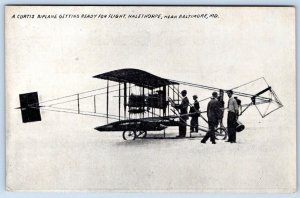 1910's CURTIS BIPLANE GETTING READY FOR FLIGHT HALETHORPE BALTIMORE MD POSTCARD