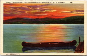 Postcard NY Lake George Sunset from Assembly Point canoe tied to dock