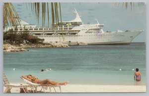 Ship~Norwegian Caribbean Lines~Woman On Beach~Boat In Distance~Vintage PC 