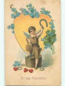 Pre-Linen valentine BLACKSMITH CUPID WITH HORSESHOE AND SLEDGEHAMMER k9742