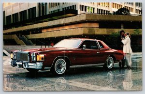 Transportation~Lady & Gentleman W/ Red Chrysler Cordoba In City~Vintage Postcard