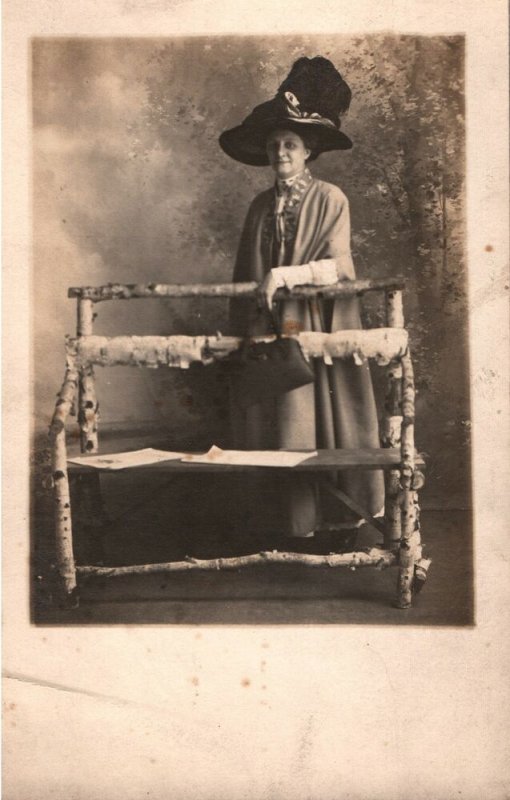 VINTAGE POSTCARD WOMAN WITH EXTRAVAGANT HAT AND PURSE REAL PHOTO CARD