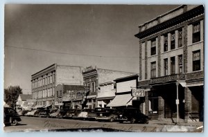 Ellendale North Dakota ND Postcard RPPC Photo Main Street Rays Cafe Clothing Car