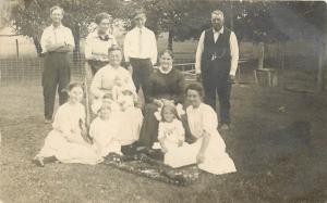 1910 RPPC Postcard Family Portrait in Yard Almost Everyone is Smiling Unknown US