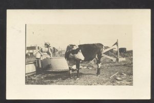 RPPC DAVID CITY IOWA HAWKINS FARM 1916 WOMAN FEEDING COWS REAL PHOTO POSTCARD