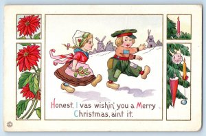 c1910's Christmas Dutch Kids Berries Windmill Winter Scene Poinsettia Postcard