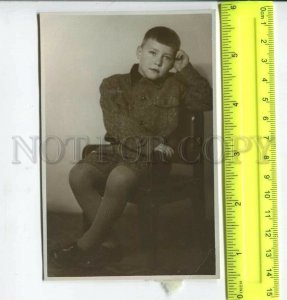 452476 USSR pensive boy on a chair Old photo