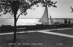 Clear Lake Iowa @ Sunset~Taking Down Sail on Boat~People by Benches~1940s RPPC