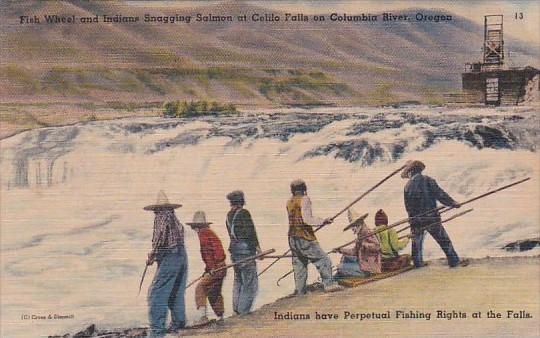 Fish Wheel and Indians Snagging Salmon At Celilo Falls On Columbia River Oregon