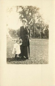 c1910 RPPC Sweet Young Mother & Toddler Child on a Large Lawn w Trees Unknown US