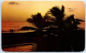 Postcard - Sunset seen though the palm trees in Mazatlán, Mexico