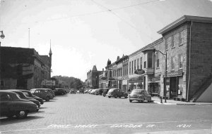 Front Street Cars Rexall Drug Store Elkader Iowa 1950c RPPC Real Photo postcard
