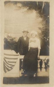 RPPC Studio Photo Postcard Man With Pinstripe Suit and Woman With Giant Bow tie