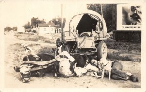 H96/ Colorado Springs RPPC Postcard c30s Cow-Drawn Wagon Nap Cowboy 132