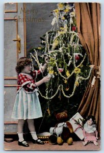 Christmas Postcard Little Girl Decorating Christmas Tree Embossed Taylor MO 1914