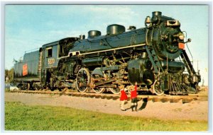 MONCTON, New Brunswick, Canada ~Kids Admire C N RAILROAD ENGINE c1950s Postcard