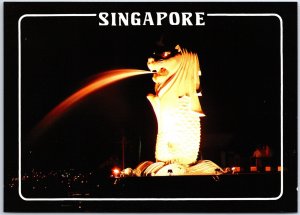 VINTAGE CONTINENTAL SIZE POSTCARD NIGHT VIEW OF SINGAPORE RIVER MOUTH