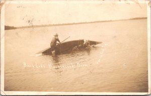 Real Photo Postcard Men Tipped Over Canoe at Birch Lake in Hackensack, Minnesota